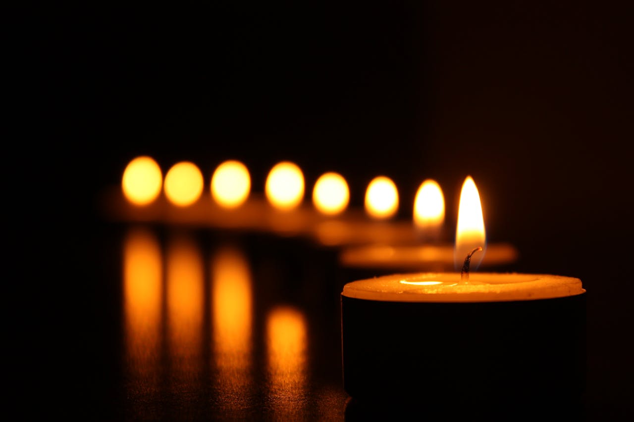 The Art of Drawing Readers In: Your attractive post title goes here A close-up view of tealight candles reflecting a warm glow in the dark.